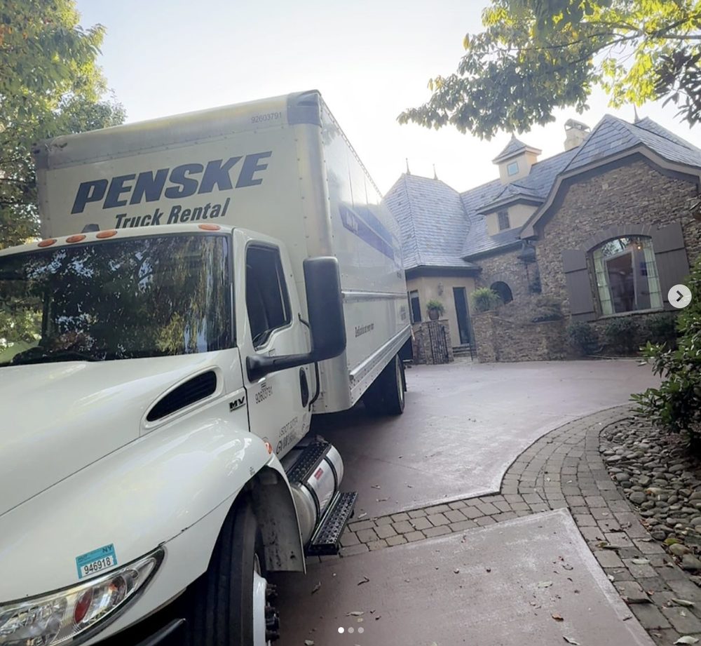 Penske moving truck at a stone-front Upstate SC estate