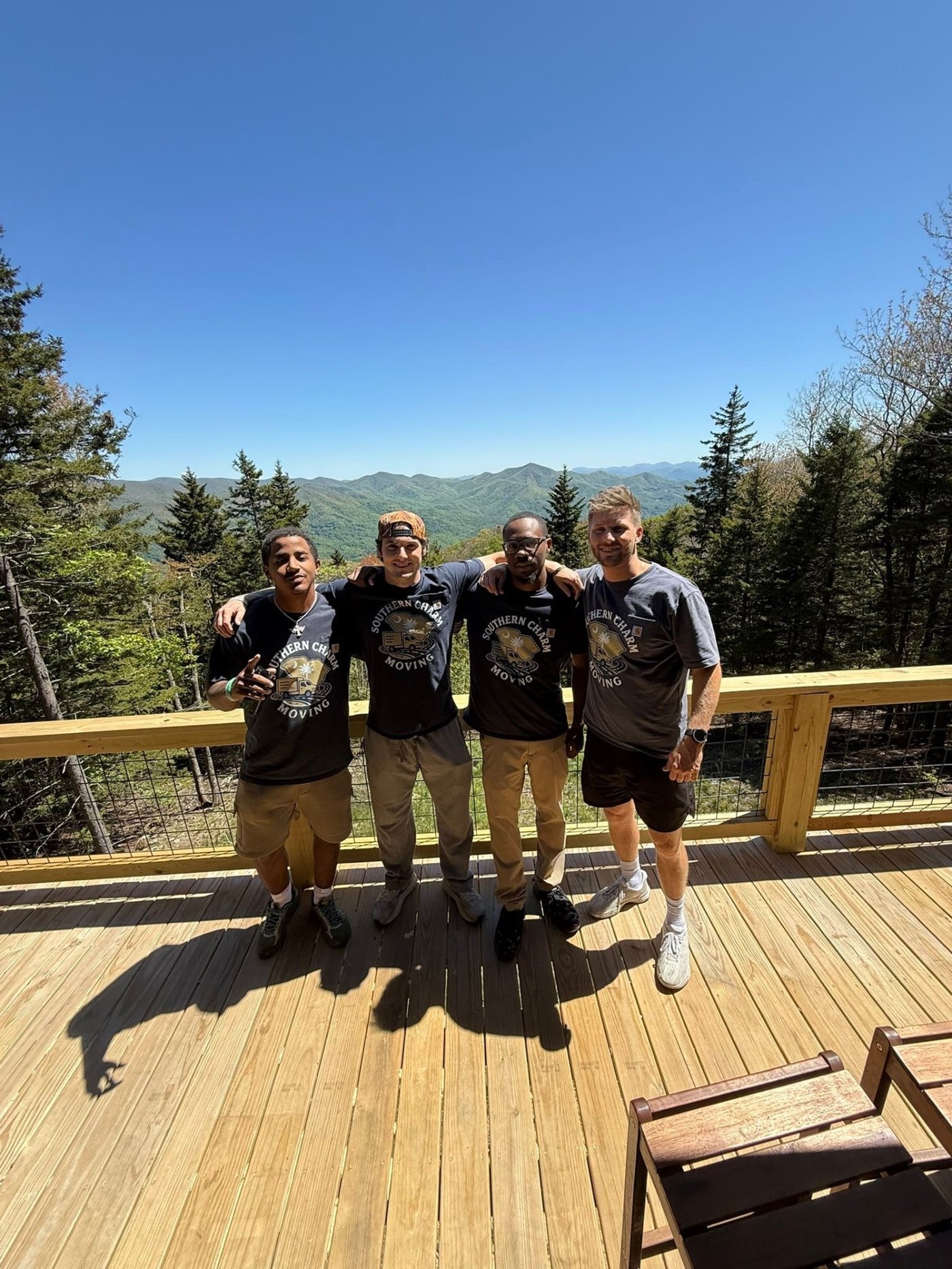 The Southern Charm Moving crew on a mountain deck job site in the Upstate